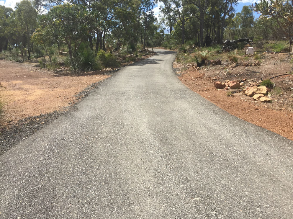 This is a photo of a hot spray & seal bitumen driveway which is in the process of being installed by Langwarrin Surfacing Solutions